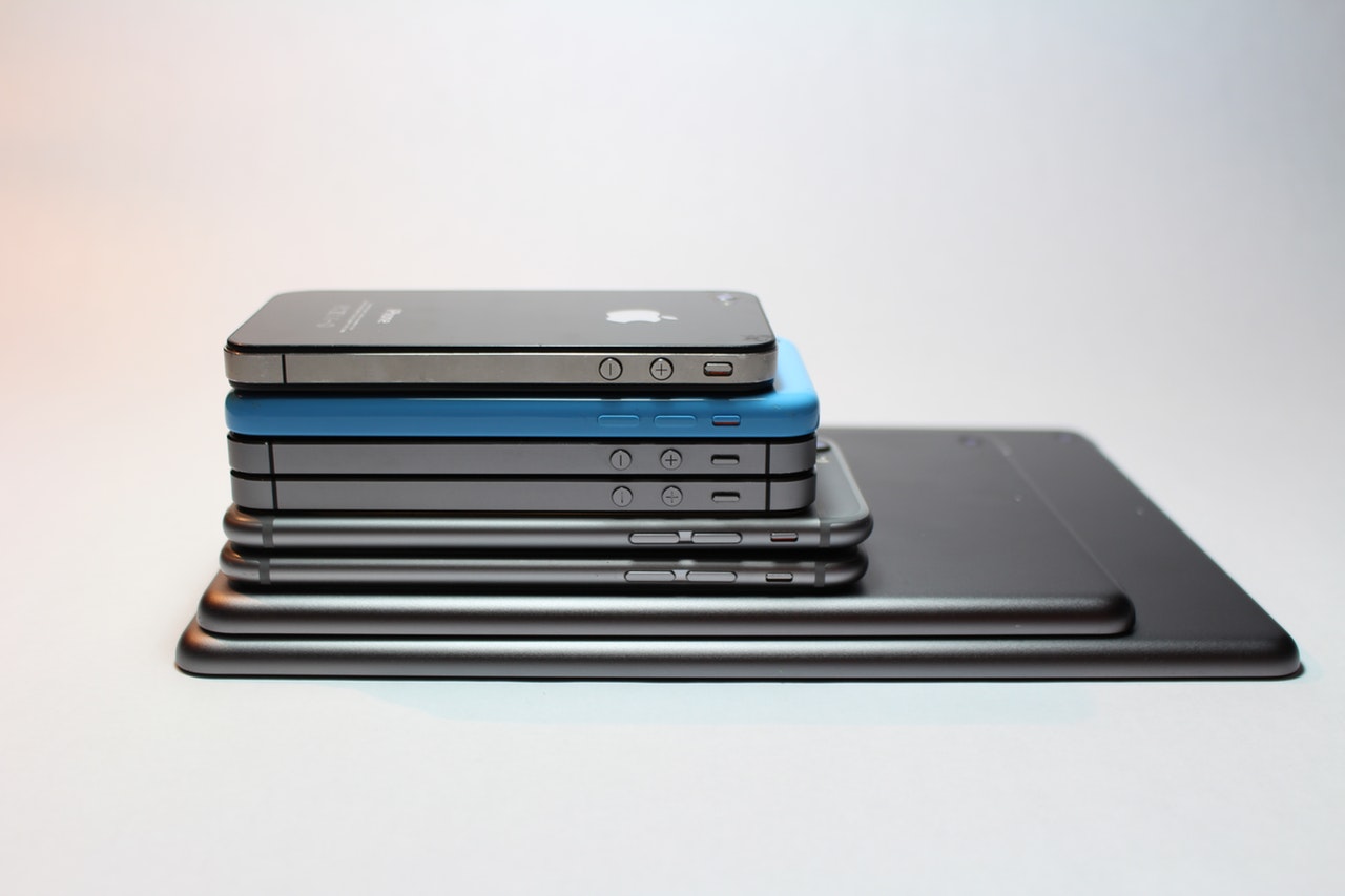 A neatly stacked collection of smartphones and tablets arranged by size, symbolizing digital evolution and mobile-first content strategy.